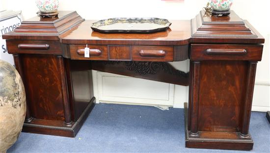 A William IV mahogany pedestal bowfront sideboard, with frieze drawer, the pedestals each with a door flanked W.202cm